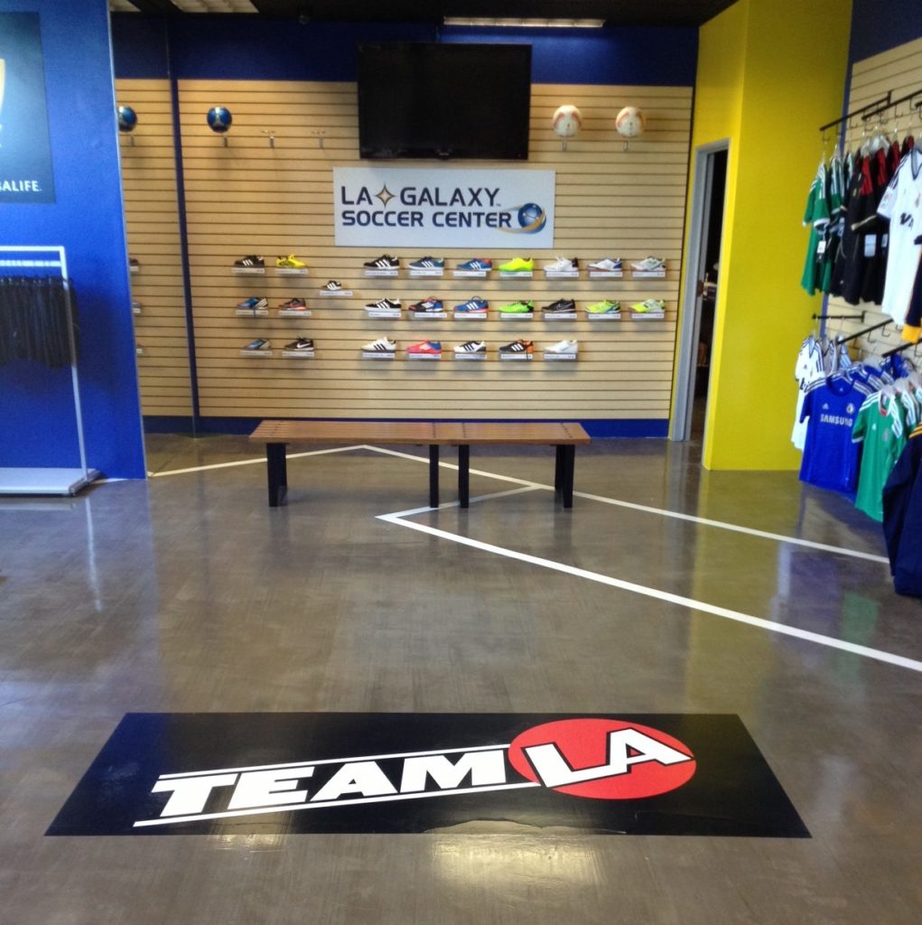 Adhesive vinyl floor graphic in a sports apparel store.